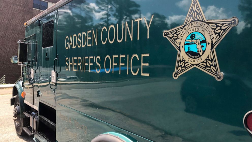 A Gadsden County Sheriff's Office van in parked at their main office, Wednesday, July 6, 2022, in Quincy, Fla. (AP Photo/Anthony Izaguirre)