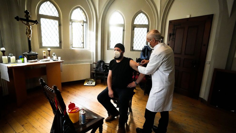 In eastern Germany, pastors push for shots despite protests