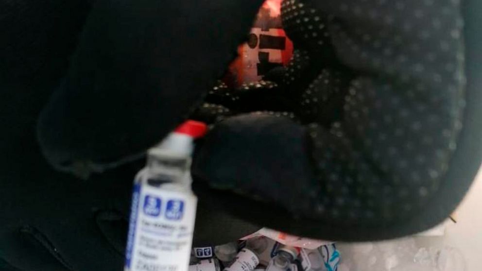 In this photo released by Mexico's tax agency, SAT, on March 17, 2021, officials show vials of seized, alleged Sputnik V vaccines for COVID-19 in Campeche, Mexico. RDIF, the Russian entity that paid for the vaccine's development, said these vaccines 