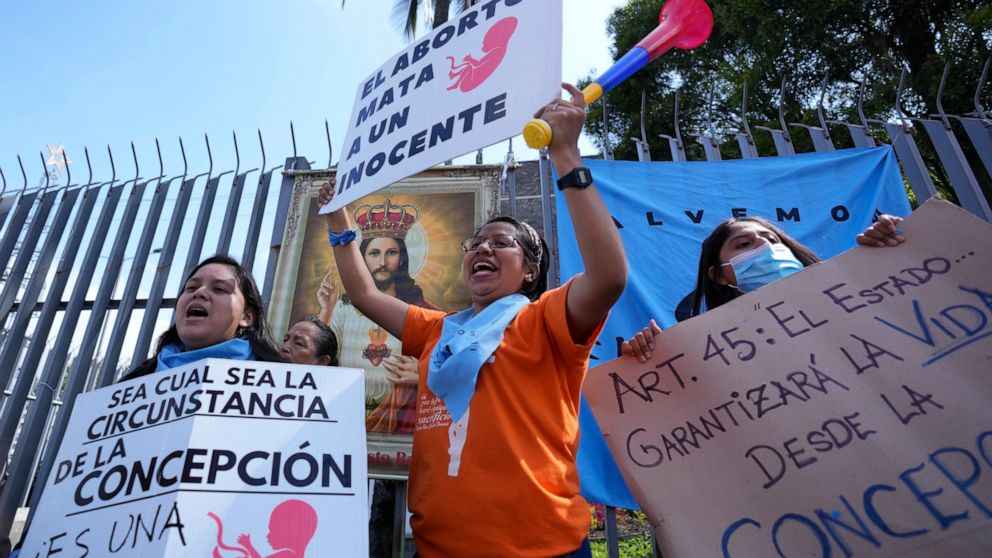 Anti-abortion activists demonstrate outside the National Assembly as lawmakers vote on whether to allow abortion in all cases of rape, in Quito, Ecuador, Thursday, Feb. 17, 2022. Currently, abortion is legal in Ecuador if the mother’s life is in dang