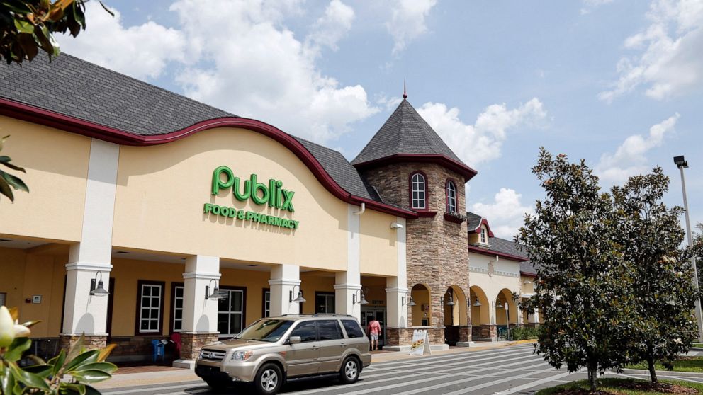 FILE - A vehicle passes the front of the Publix supermarket in Zephyrhills, Fla. on May 19, 2013. The Florida-based Publix grocery store chain is not offering the COVID-19 vaccine to children younger than 5 but has not explained its decision, accordi