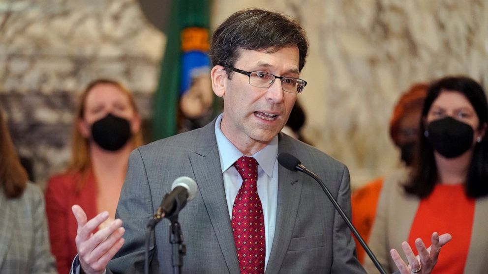 FILE - Washington Attorney General Bob Ferguson speaks March 23, 2022, at the Capitol in Olympia, Wash. Months into a complex trial over their role in flooding Washington with highly addictive painkillers, the nation's three largest opioid distributo