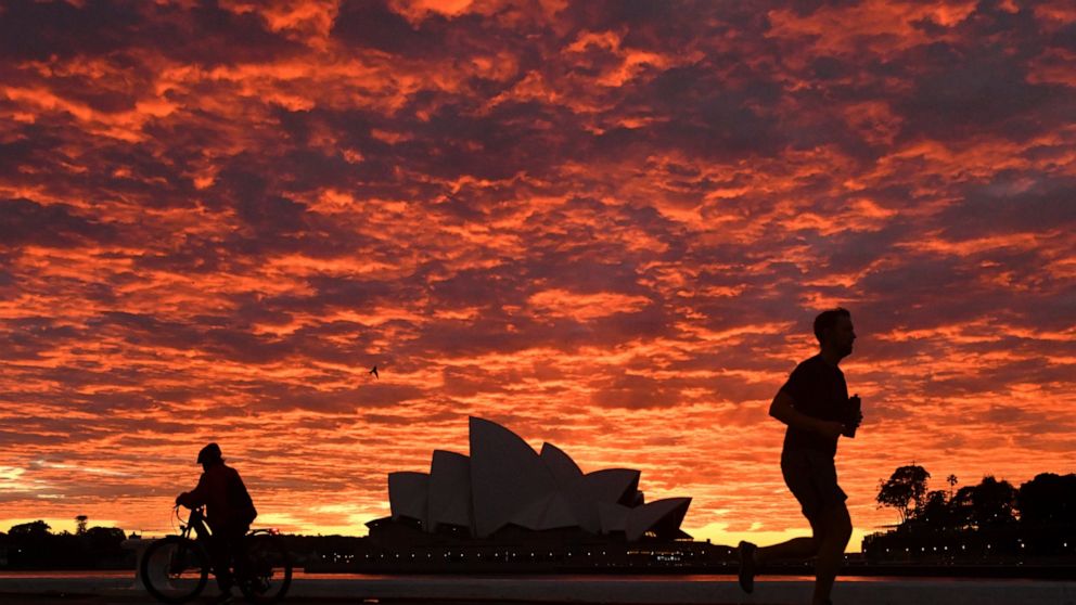 The Latest: Australia state reports record daily infections
