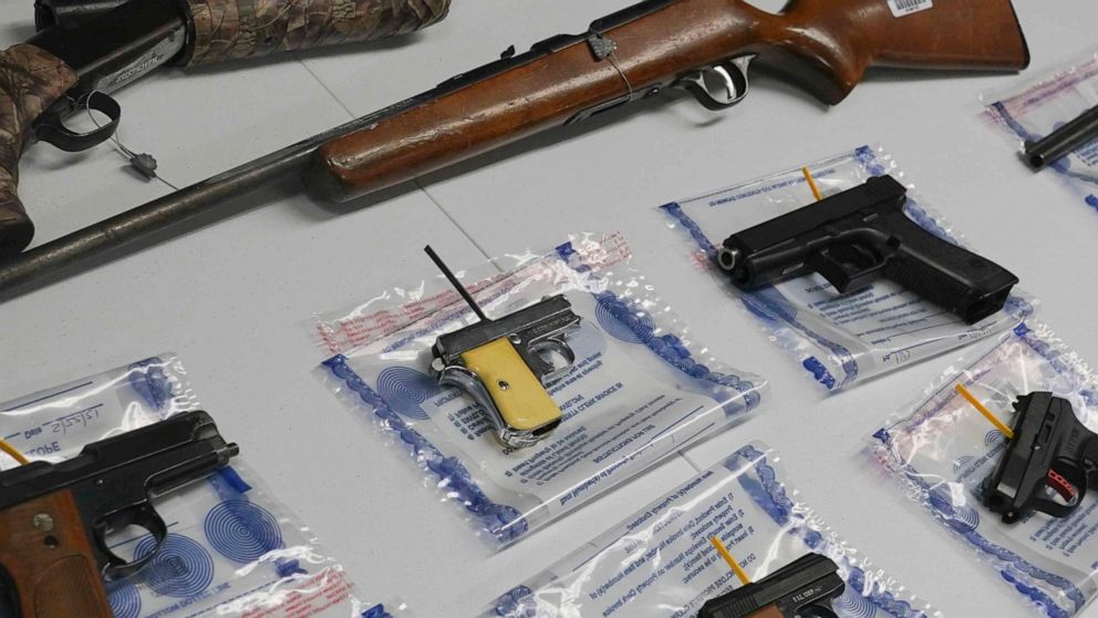 FILE - A collection of illegal guns is displayed during a gun buyback event, Saturday May 22, 2021 in the Brooklyn borough of New York. Individuals received pre-paid card payments of $25 up to $250 for firearms - with a bonus iPad for certain handgun