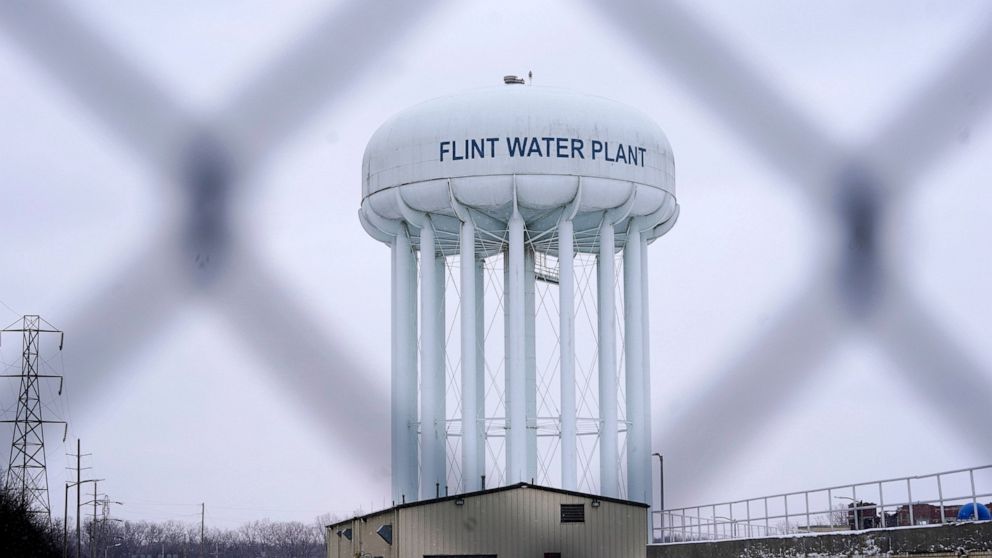 FILE - The Flint water plant tower is seen, Thursday, Jan. 6, 2022, in Flint, Mich. A Michigan Supreme Court order that charges related to the Flint water scandal against former Gov. Rick Snyder, his health director and seven other people must be dis