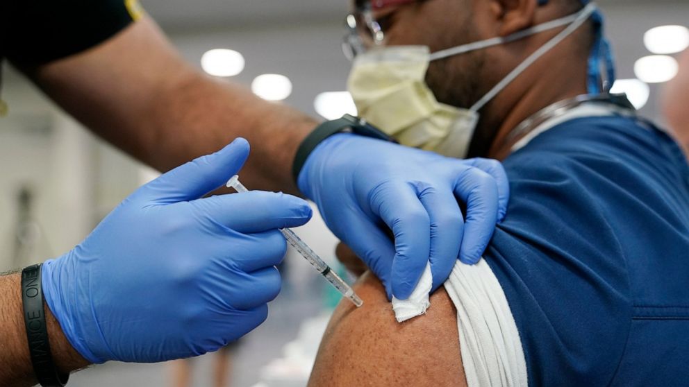 A healthcare worker receives a Pfizer COVID-19 booster shot at Jackson Memorial Hospital Tuesday, Oct. 5, 2021, in Miami. This follows a recent recommendation by the Food and Drug Administration and Centers for Disease Control and Prevention advising