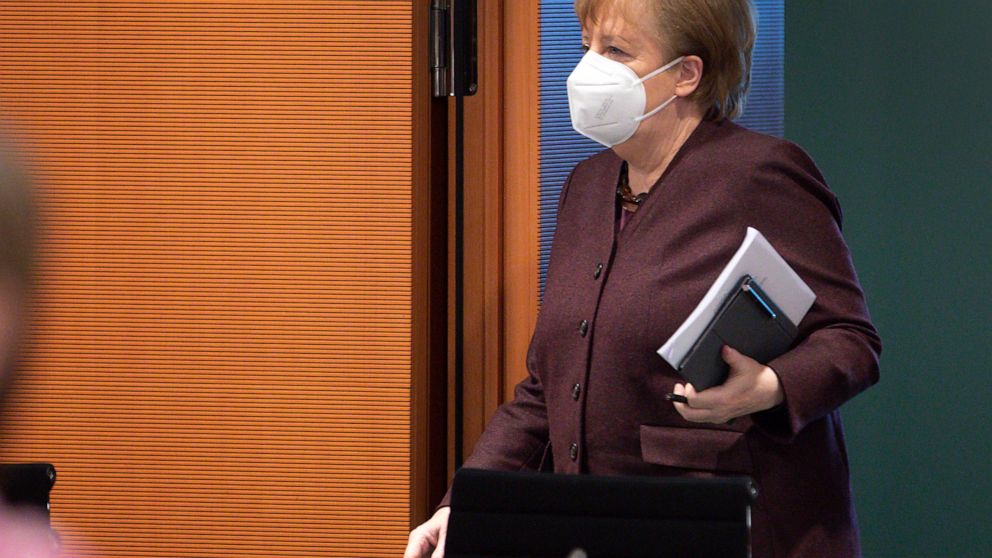 German Chancellor Angela Merkel arrives for the weekly cabinet meeting in Berlin, Germany, Wednesday, Feb. 10, 2021. (AP Photo/Michael Sohn, pool)