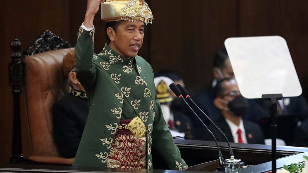 Indonesian President Joko Widodo gestures as he delivers his annual State of the Nation Address ahead of the country's Independence Day, at the parliament building in Jakarta, Indonesia, Tuesday, Aug. 16, 2022. (Bagus Indahono/Pool Photo via AP)