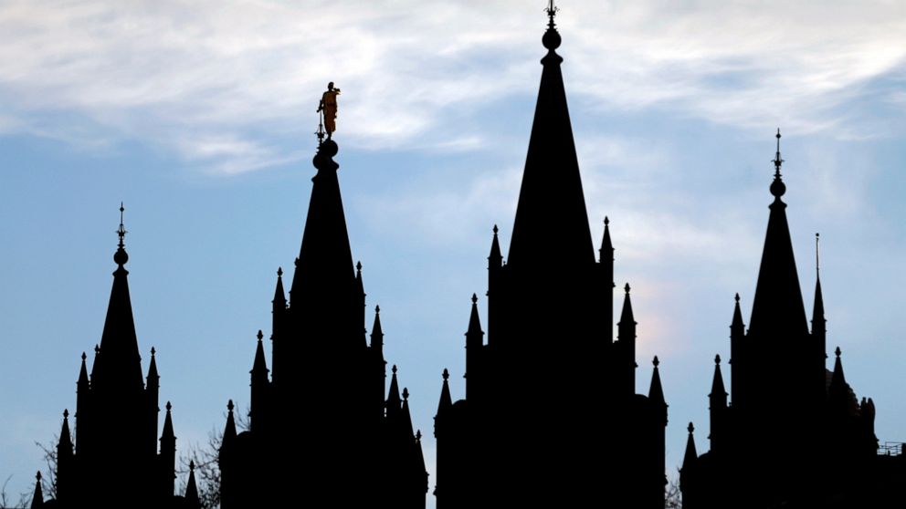 FILE - In this Jan. 3, 2018, file photo, the angel Moroni statue, silhouetted against the sky, sits atop the Salt Lake Temple at Temple Square in Salt Lake City. Utah is set to become the 19th state to enact a ban on the discredited practice of conve