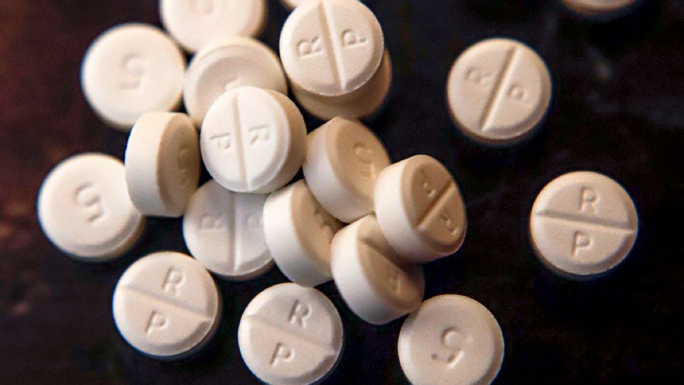 FILE - This June 17, 2019, file photo shows 5-mg pills of Oxycodone. The nation’s top public health agency on Thursday, Nov. 3, 2022, revised its controversial guidelines for U.S. doctors prescribing oxycodone and other opioid painkillers. (AP Photo/