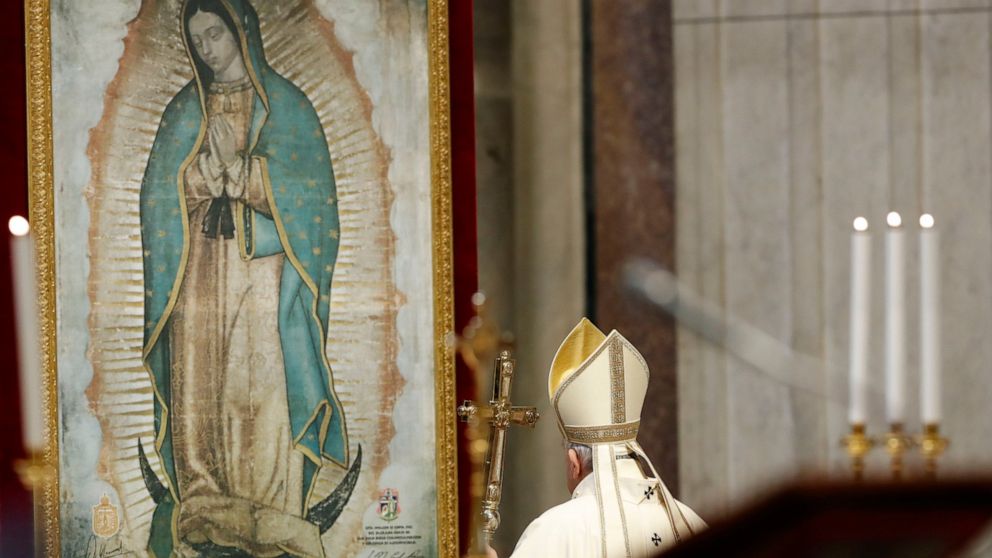 Pope Francis celebrates Mass on the occasion of the feast of Our Lady of Guadalupe, in St. Peter's Basilica at the Vatican, Saturday, Dec. 12, 2020. (Remo Casilli/Pool via AP)