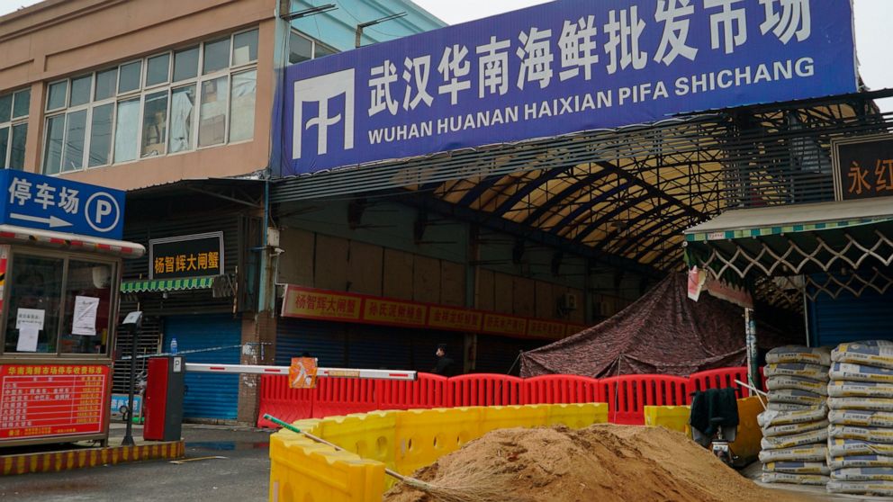 FILE - In this Jan. 21, 2020, file photo, the Wuhan Huanan Wholesale Seafood Market, where a number of people related to the market fell ill with a virus, sits closed in Wuhan in central China's Hubei province. The Chinese city of Wuhan is looking ba
