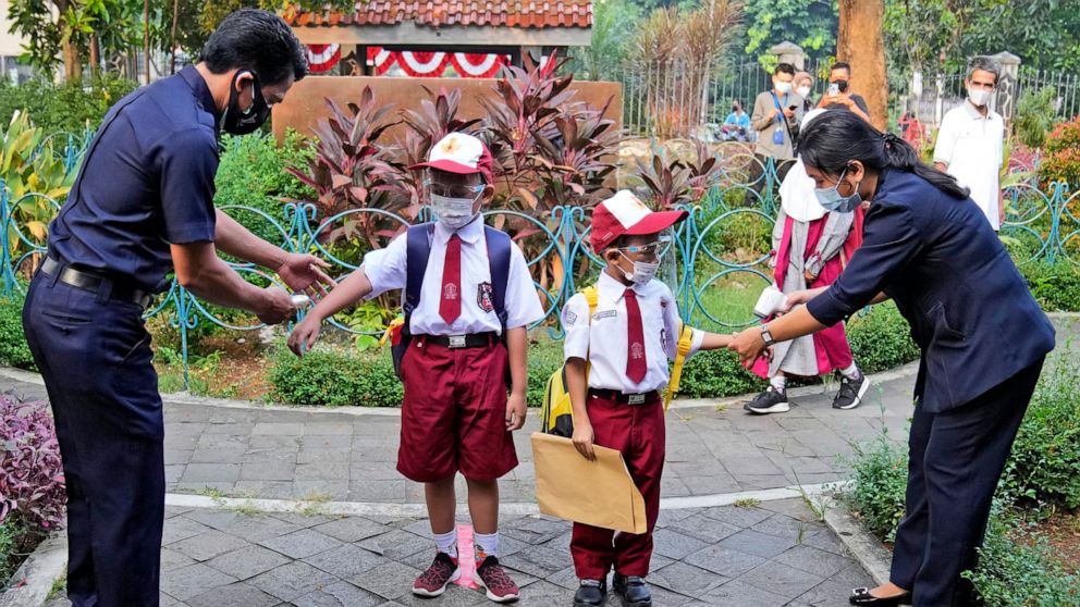 Some Indonesian students return to schools, at a distance