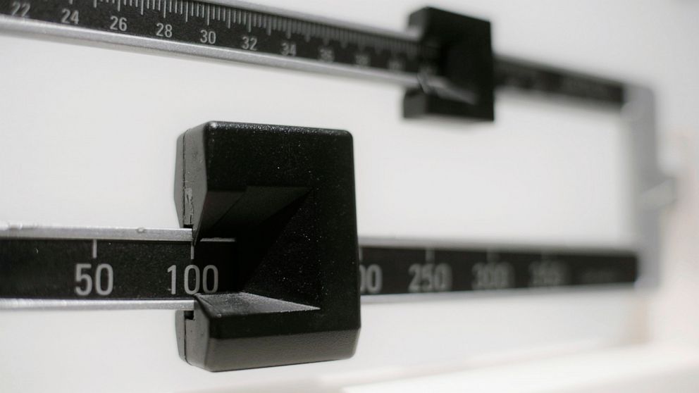 FILE - This April 3, 2018, file photo shows a closeup of a beam scale in New York. A study released on Tuesday, June 18, 2019, found U.S. preschoolers on government food aid have grown a little less pudgy, offering fresh evidence that previous signs 