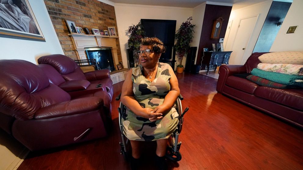 India Scott sits in the living room of her home in New Orleans, Monday, Oct. 10, 2022. Activists, advocates, researchers and people living with disabilities say not enough is being done to include disabled people in climate action planning and policy