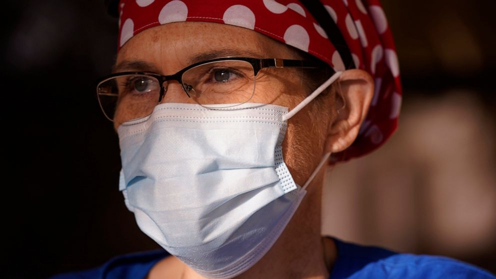 Nurse Teri Wheat poses for a photo in Fort Worth, Texas, Thursday, Nov. 19, 2020. As Wheat recently made her rounds at a Texas maternity ward, she began to realize she was having a hard time understanding the new mothers who were wearing masks due to