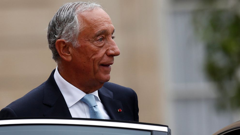 FILE - In this Sunday, July 14, 2019 file photo, Portugal's President Marcelo Rebelo de Sousa leaves after a lunch at the Elysee Palace that followed Bastille Day parade on the Champs-Elysees avenue in Paris. The office of Portugal's 71-year-old pres