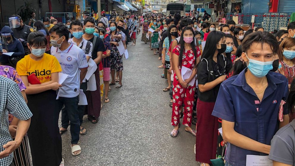 Thousands line up for tests amid the outbreak of the virus in Thailand