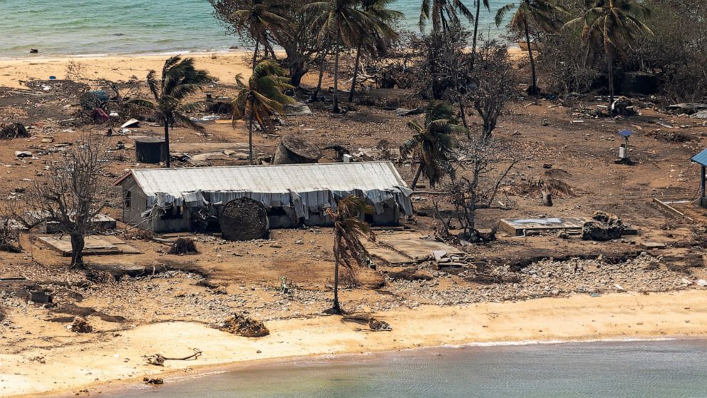 FILE - In this photo provided by the Australian Defense Force, debris from damaged building and trees are strewn around on Atata Island in Tonga on Jan. 28, 2022, following the eruption of an underwater volcano and subsequent tsunami. Coronavirus cas