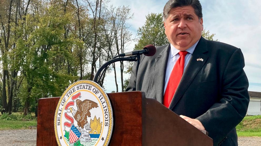 FILE - Illinois Gov. J.B. Pritzker announces a new round of COVID-19-related emergency housing assistance, on Oct. 27, 2021, at Abundant Faith Christian Center in Springfield, Ill. Democrats are speaking out against school closures even as the omicro
