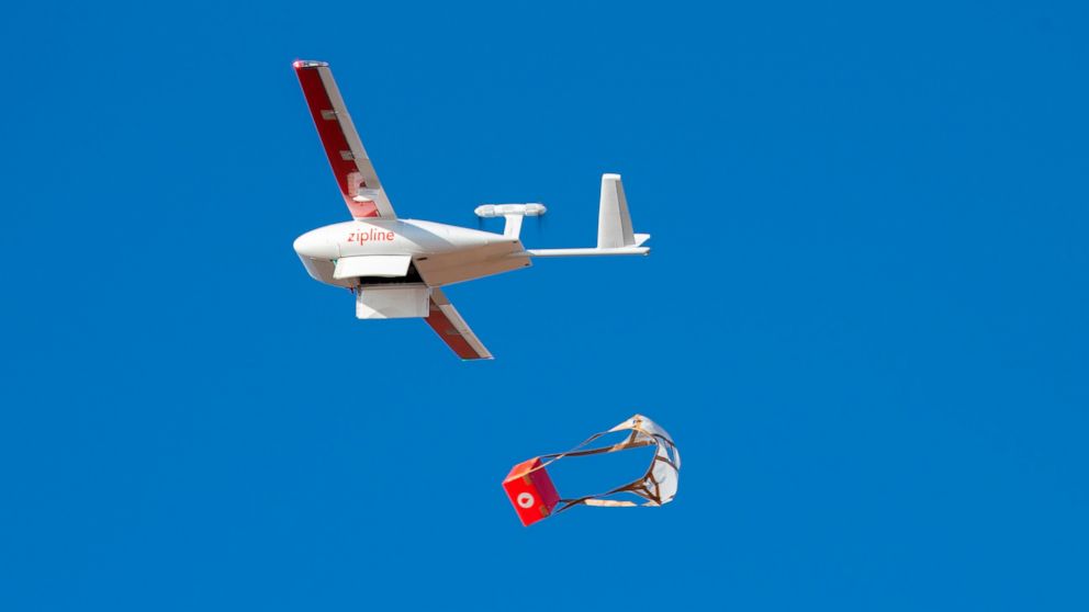 In this photo provided by Zipline, a drone makes a package drop during a demonstration at Zipline's Northern California hub in 2021. Zipline, an American company that specializes in using autonomously flying drones to deliver medical supplies, has ta