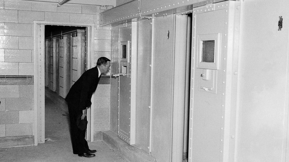 FILE - In this May 23, 1935 file photo, solitary confinement cells are shown at Rikers Island prison in New York. New York City officials have unveiled reforms they claim add up to a groundbreaking ban on solitary confinement on Rikers Island. (AP Ph