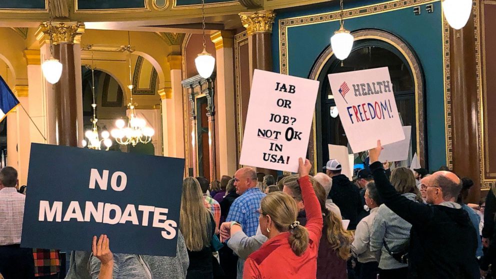 Protesters gather at the Iowa Capitol in Des Moines, Iowa, on Thursday Oct. 28, 2021, to push the Iowa Legislature to pass a bill that would prohibit vaccine mandates from being imposed on employees in Iowa. Informed Choice Iowa, a group opposing vac