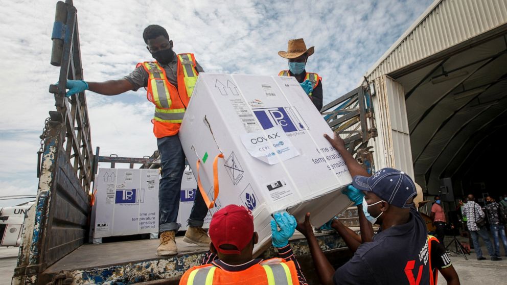 FILE - In this March 15, 2021, file photo, boxes of COVID-19 vaccine provided through the COVAX global initiative arrive at the airport in Mogadishu, Somalia. The Biden administration plans to provide 500 million shots purchased from Pfizer to 92 low