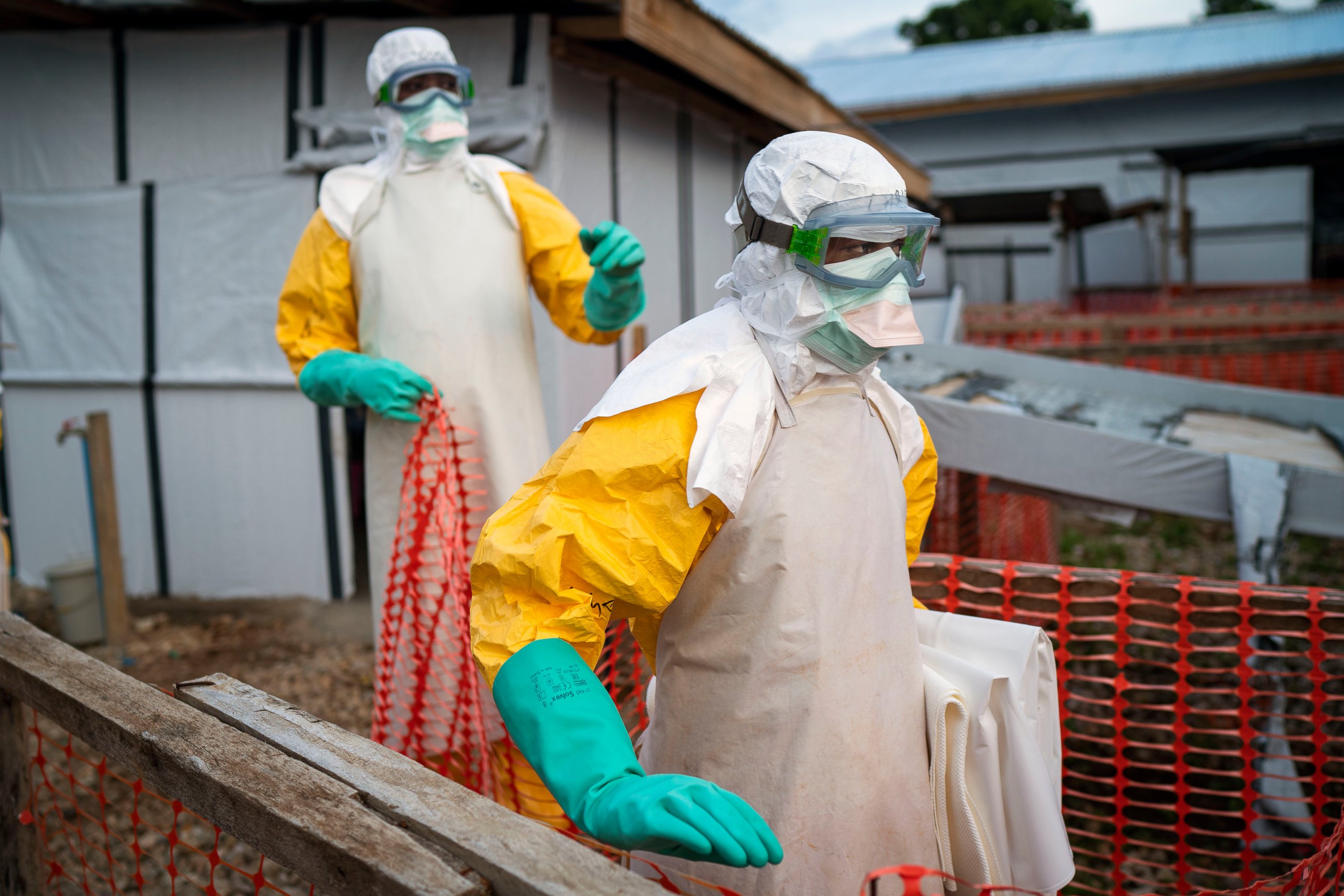 PHOTO: In this photograph taken Saturday July 13, 2019, health workers wearing protective suits take their shift at a treatment center in Beni, Congo DRC.