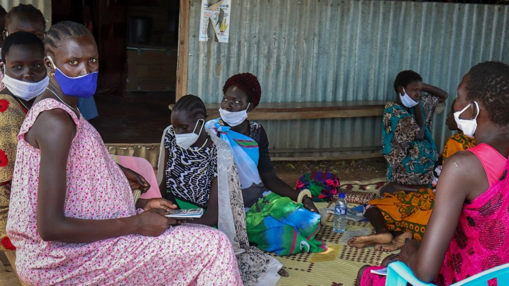 Expectant mothers sit on the floor as they wait to attend a monthly checkup at the Mingkaman Reproductive Health Clinic in the village of Mingkaman, Awerial County, in the Lakes State of South Sudan Wednesday, Oct. 19, 2022. In a country with one of 