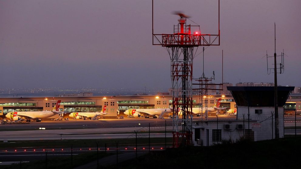 FILE - In this file photo dated Thursday, Jan. 28, 2021, airplanes are parked at Lisbon's international airport. British tourists will be admitted to Portugal on nonessential travel from May 17, ending days of uncertainty over whether thousands of U.
