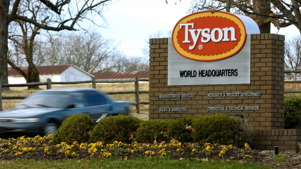 FILE - In this Jan. 29, 2006, file photo, a car passes in front of a Tyson Foods Inc., sign at Tyson headquarters in Springdale, Ark. Tyson Foods is recalling almost 4,500 tons of ready-to-eat chicken products after finding the products may be tainte