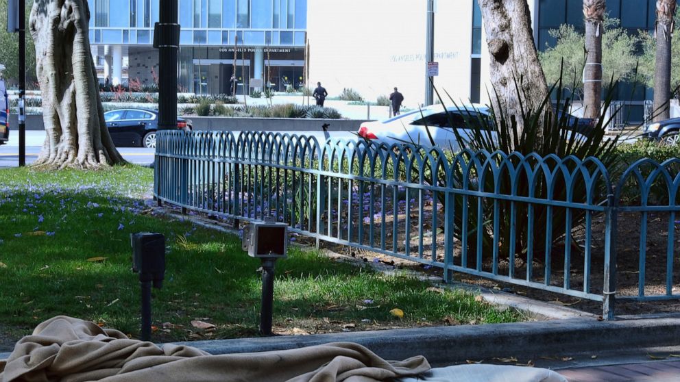 An abandoned sleeping bag and blanket is left in on the grounds of Los Angeles City Hall across the street from Los Angeles Police Department headquarters on Thursday, May 30, 2019. The union that represents the LAPD is demanding a cleanup of homeles