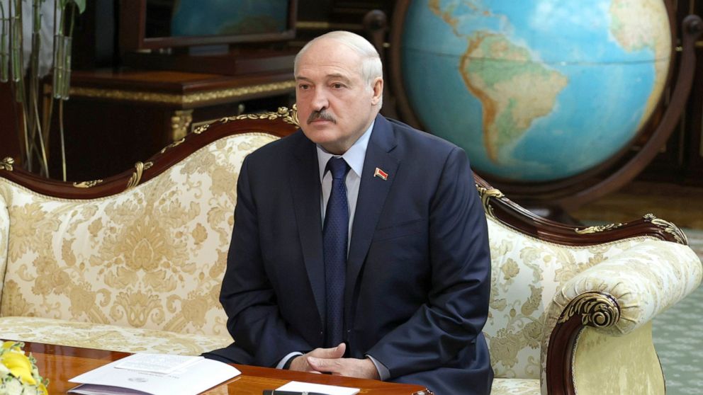 FILE - In this Thursday, Oct. 14, 2021 file photo, Belarusian President Alexander Lukashenko listens to World Health organization Director for Europe Hans Kluge during their meeting in Minsk, Belarus. Belarusian authorities on Friday, Oct. 22, 2021 a