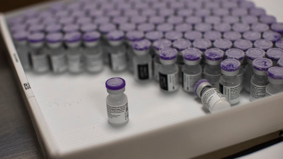 FILE - In this Monday, Jan. 4, 2021 file photo, frozen vials of the Pfizer/BioNTech COVID-19 vaccine are taken out to thaw, at the MontLegia CHC hospital in Liege, Belgium. Envoys from World Trade Organization member nations are taking up a proposal 