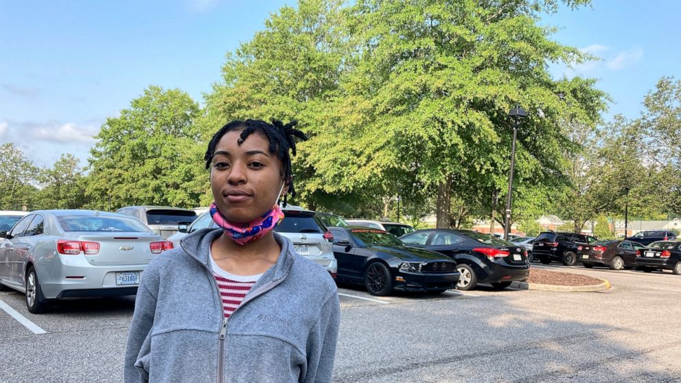 FILE - In this Monday Aug. 2, 2021, file photo, Tiara Burton stands outside a courthouse in Virginia Beach, Va. Burton was facing eviction proceedings over unpaid rent but said that she was able to work things out with her landlord. An attorney repre