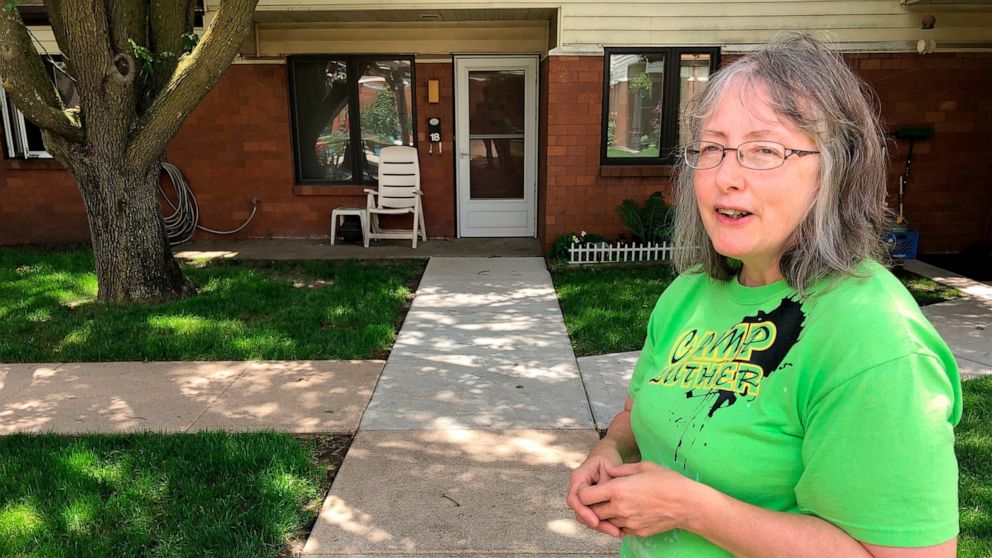 In this June 14, 2019 photo, Marti Poll, 55, discusses her struggle to get health care for a variety of conditions outside her apartment complex outside of Lincoln, Nebraska. Poll is one of the estimated 90,000 people who could get coverage under the