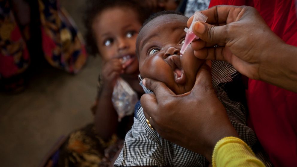 FILE - In this Wednesday, April 24, 2013 file photo, a Somali baby receives a polio vaccine at the Medina Maternal Child Health center in Mogadishu, Somalia. Health authorities on Tuesday, Aug. 25, 2020 are expected to declare the African continent f