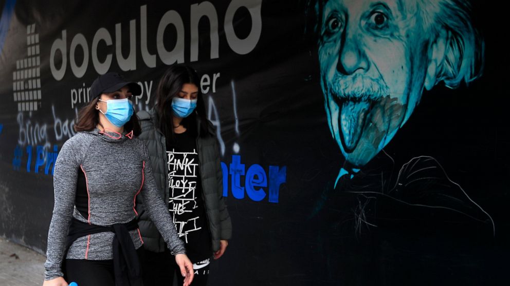 Lebanese women wear masks to help prevent the spread of the coronavirus, in Beirut, Lebanon, Wednesday, Jan. 27, 2021. Lebanon, a country of nearly 5 million and over 1 million refugees, is going through an unprecedented economic crisis that preceded