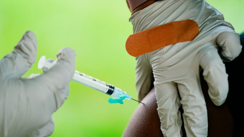 FILE - In this Sept. 14, 2021, file photo, a health worker administers a dose of a Pfizer COVID-19 vaccine during a vaccination clinic in Reading, Pa. Pfizer, Thursday, April 14, 2022, wants to expand its COVID-19 booster shots to healthy 5- to 11-ye