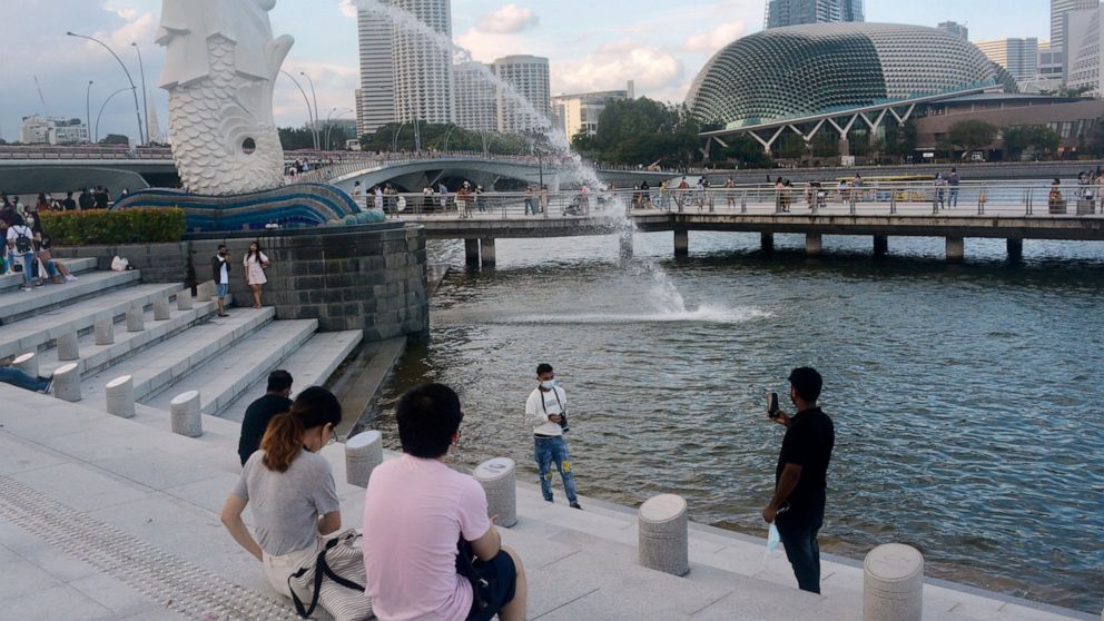 Living with COVID; Singapore strategy raises concerns, hope