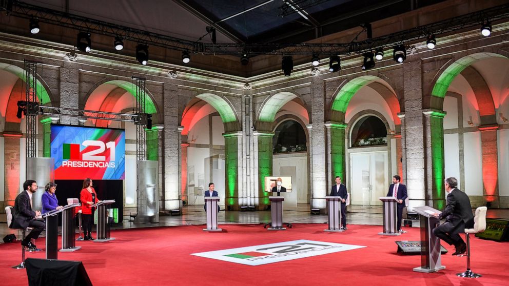 Portuguese President Marcelo Rebelo de Sousa, who is seeking a second term in the country's presidential election on Jan. 24, participates through video link, center, in a presidential election debate on national television, Tuesday night, Jan. 12, 2