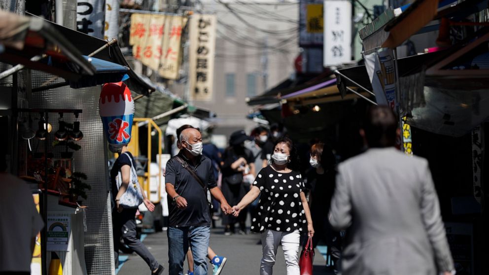 The Latest: More than 50% of Japan's population vaccinated