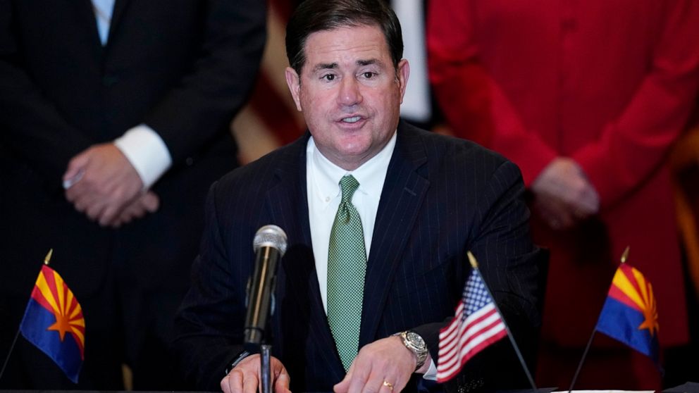 FILE - In this Thursday, April 15, 2021, file photo, Arizona Republican Gov. Doug Ducey speaks during a bill signing in Phoenix. Ducey on Tuesday, April 27, 2021, signed a sweeping anti-abortion bill that bans the procedure if the woman is seeking it