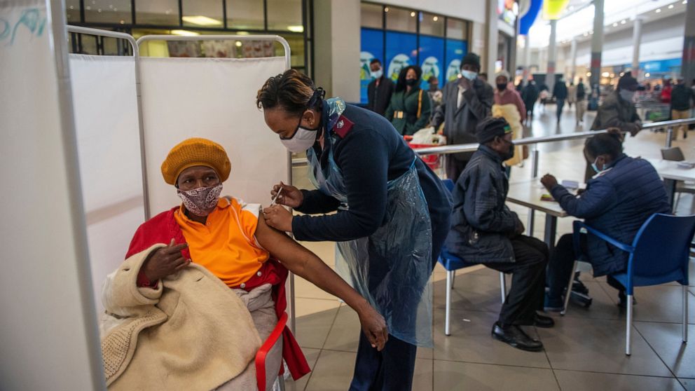 FILE - In this July 6, 2021, file photo, a patient receives a Johnson & Johnson vaccine against COVID-19 in Hammanskraal, South Africa. South Africa's COVID-19 vaccination campaign is regaining momentum after being disrupted earlier this month by a w