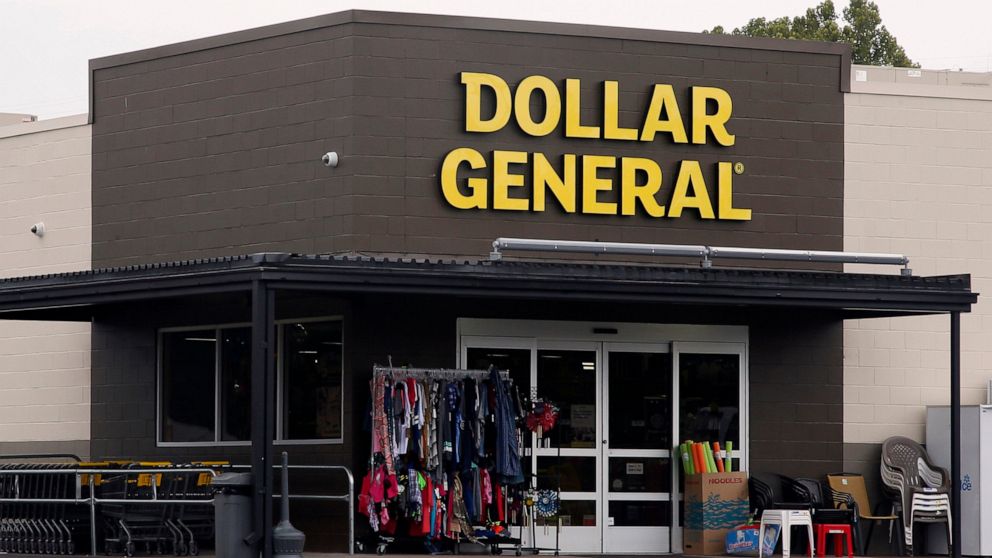 FILE- In this Aug. 3, 2017, file photo the Dollar General store is pictured in Luther, Okla. As vaccinations continue across the U.S., some companies are offering financial incentives to encourage their workers to get the shots. Dollar General is one