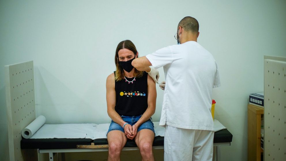 FILE - Daniel Rofin, 41, receives a vaccine against Monkeypox from a health professional in medical center in Barcelona, Spain, Tuesday, July 26, 2022. Public health officials warn that moves by rich countries to buy large quantities of monkeypox vac