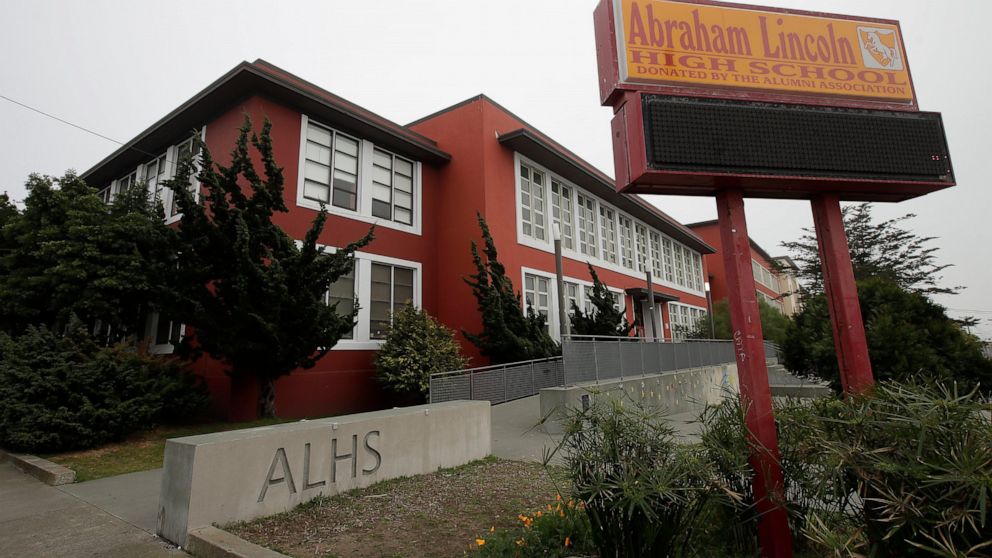FILE - This Thursday, March 12, 2020 shows Abraham Lincoln High School in San Francisco. Staggered start times. Classes cut in half. Social distancing in the hallways and cafeteria. Classes on, then off again. These are just a few of the possible sce