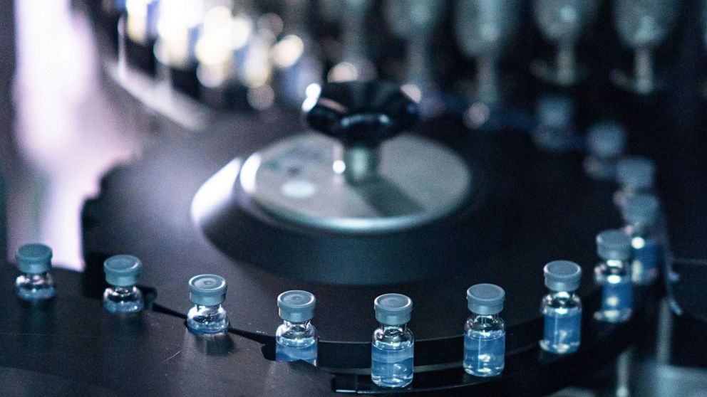 FILE - This August 2022 photo provided by Pfizer shows vials of the company's updated COVID-19 vaccine during production in Kalamazoo, Mich. New booster shots are here and social distancing guidelines are easy but COVID-19 infections aren't going awa
