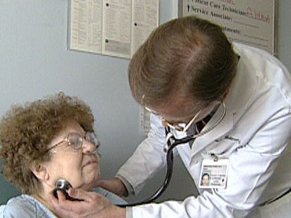 A picture of a doctor examining a patient.